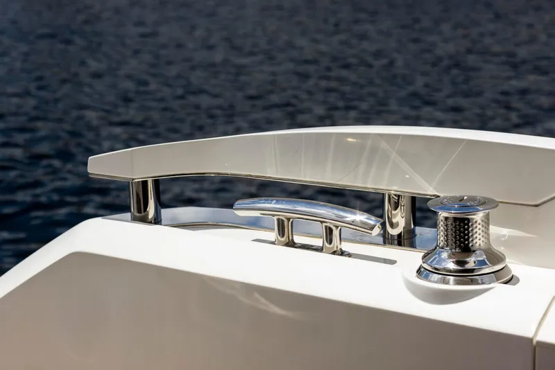 Slide: The Image of Close-up of 2021 Sunseeker Manhattan 68 yacht's sleek chrome fittings by the water. - 137