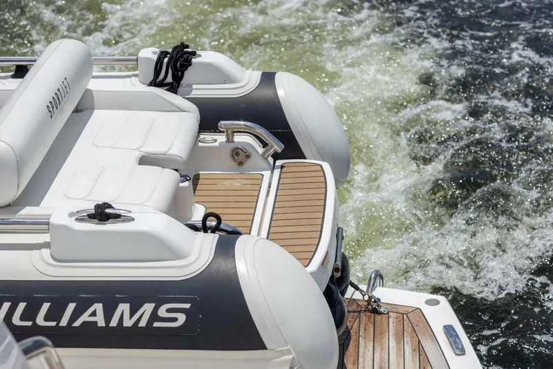Slide: The Image of Rear view of a 2021 Sunseeker Manhattan 68 yacht with Williams Sportjet tender. - 138