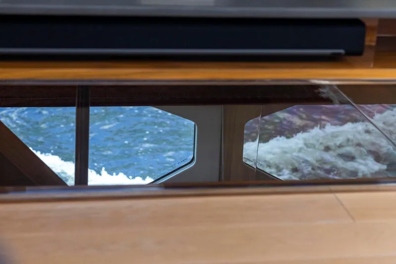 Slide: The Image of Interior view of 2021 Sunseeker Manhattan 68 yacht with ocean reflections. - 140