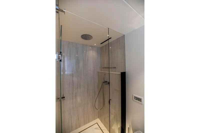 Slide: The Image of Luxurious shower in 2021 Sunseeker Manhattan 68 yacht, featuring modern glass enclosure. - 15