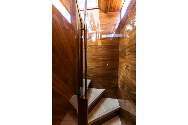 Slide: The Image of Luxurious wooden staircase inside 2021 Sunseeker Manhattan 68 yacht. - 16