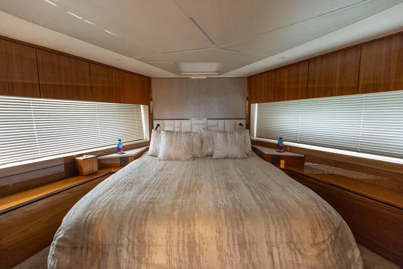 Slide: The Image of Luxurious bedroom interior of 2021 Sunseeker Manhattan 68 yacht with elegant wood finishes. - 19