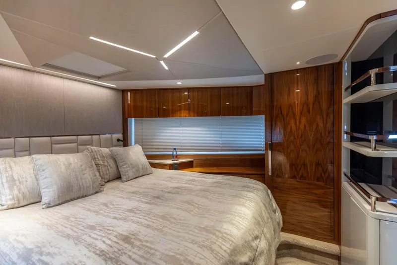 Slide: The Image of Luxurious bedroom interior of 2021 Sunseeker Manhattan 68 yacht with elegant wood finishes. - 20