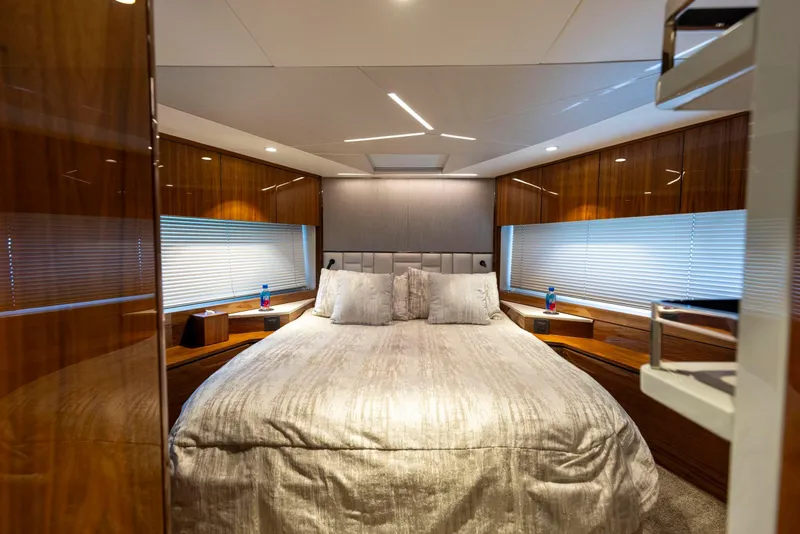 Slide: The Image of Luxurious bedroom interior of 2021 Sunseeker Manhattan 68 yacht with elegant wood finishes. - 25