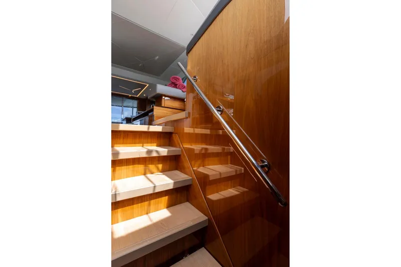 Slide: The Image of Staircase with wooden finish on 2021 Sunseeker Manhattan 68 yacht interior. - 29