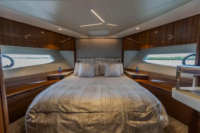 Slide: The Image of Luxurious bedroom interior of 2021 Sunseeker Manhattan 68 yacht with elegant wood finishes. - 35