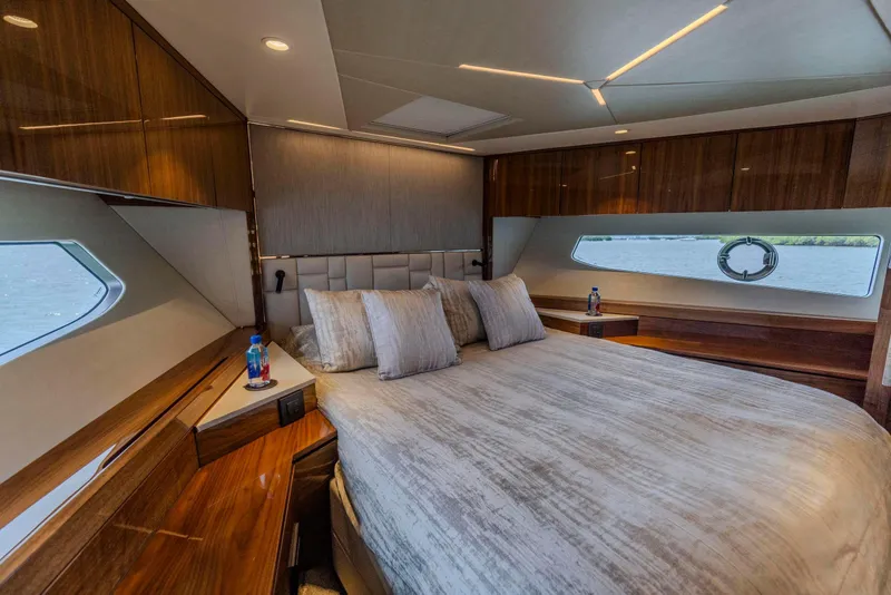 Slide: The Image of Luxurious bedroom interior of 2021 Sunseeker Manhattan 68 yacht with elegant wood finishes. - 36