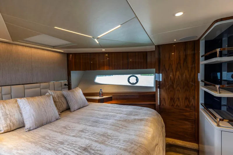 Slide: The Image of Luxurious bedroom interior of 2021 Sunseeker Manhattan 68 yacht with elegant wood finishes. - 37