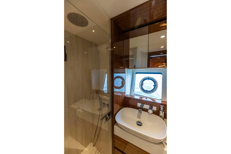 Slide: The Image of Luxurious bathroom on 2021 Sunseeker Manhattan 68 yacht with modern fixtures and ocean view. - 41