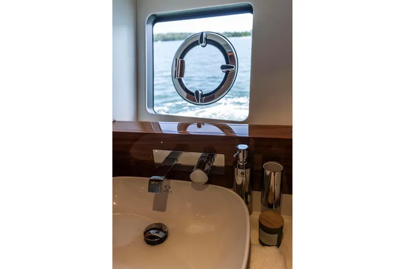 Slide: The Image of Luxurious bathroom sink on 2021 Sunseeker Manhattan 68 yacht with ocean view. - 42