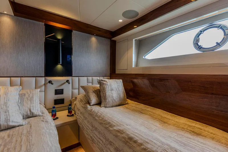 Slide: The Image of Luxurious cabin interior of 2021 Sunseeker Manhattan 68 yacht with twin beds and elegant decor. - 44