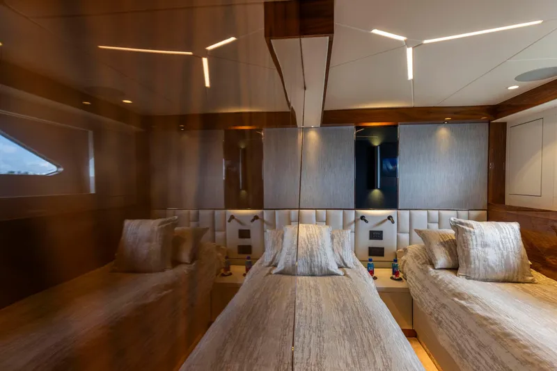 Slide: The Image of Luxurious cabin interior of 2021 Sunseeker Manhattan 68 yacht with twin beds and modern decor. - 46