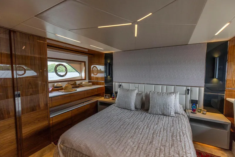 Slide: The Image of Luxurious bedroom interior of 2021 Sunseeker Manhattan 68 yacht with elegant wood finishes. - 48