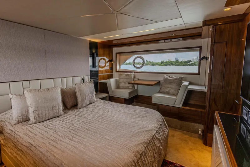 Slide: The Image of Luxurious bedroom interior of 2021 Sunseeker Manhattan 68 yacht with elegant furnishings and scenic window view. - 50