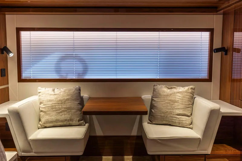 Slide: The Image of Luxurious interior of 2021 Sunseeker Manhattan 68 yacht with elegant seating and wooden accents. - 6
