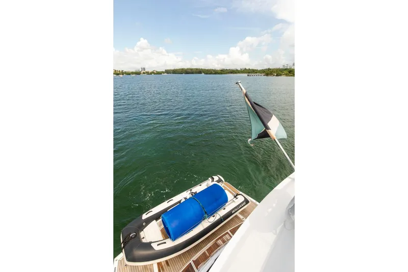 Slide: The Image of Sunseeker Manhattan 68 yacht with tender on water, 2021 model. - 63