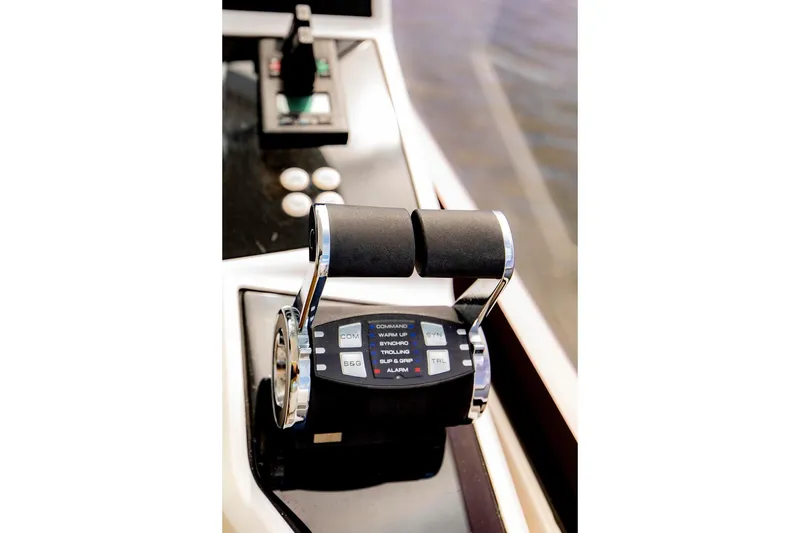 Slide: The Image of Throttle controls on a 2021 Sunseeker Manhattan 68 yacht, showcasing sleek design and functionality. - 66