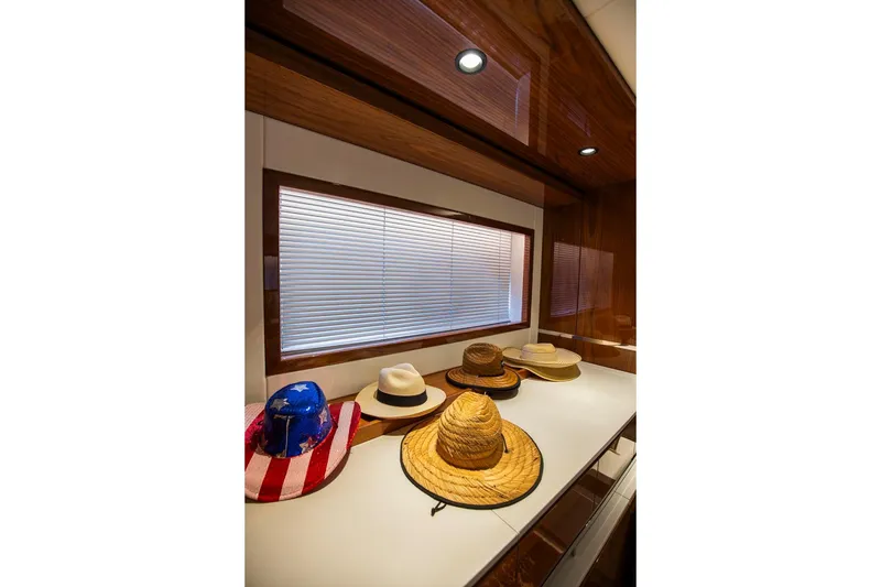Slide: The Image of Hats displayed on a Sunseeker Manhattan 68 yacht interior, 2021 model. - 7