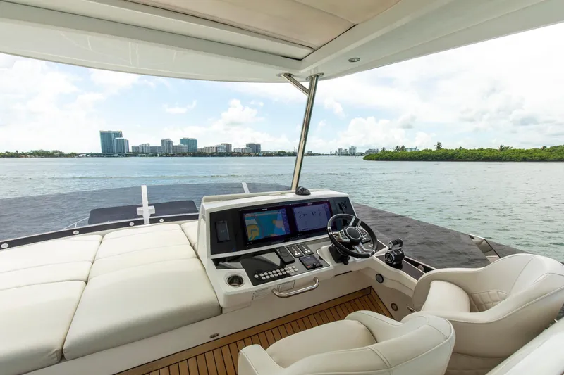 Slide: The Image of Luxurious 2021 Sunseeker Manhattan 68 yacht helm with scenic waterfront view. - 72