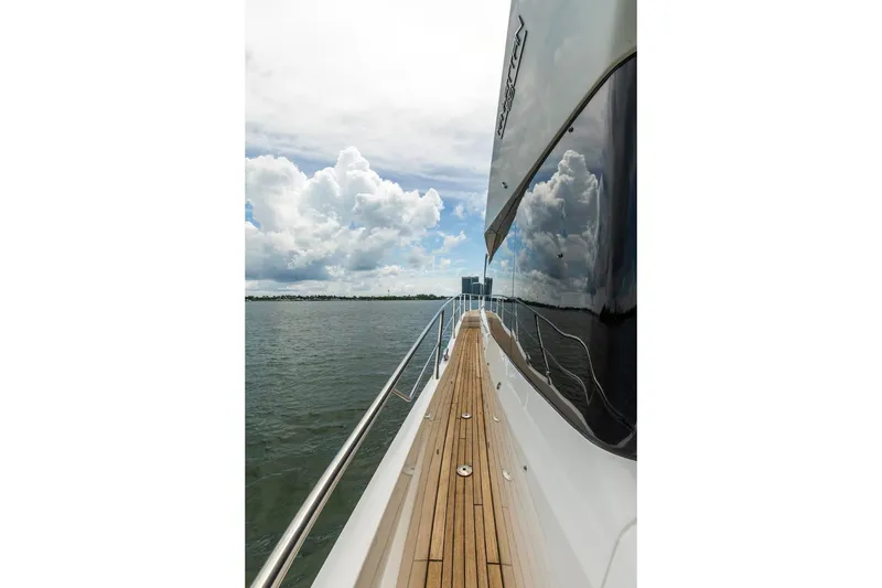Slide: The Image of Side view of 2021 Sunseeker Manhattan 68 yacht on open water under cloudy sky. - 77