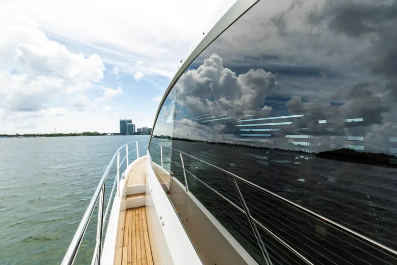 Slide: The Image of 2021 Sunseeker Manhattan 68 yacht reflecting clouds on water. - 79