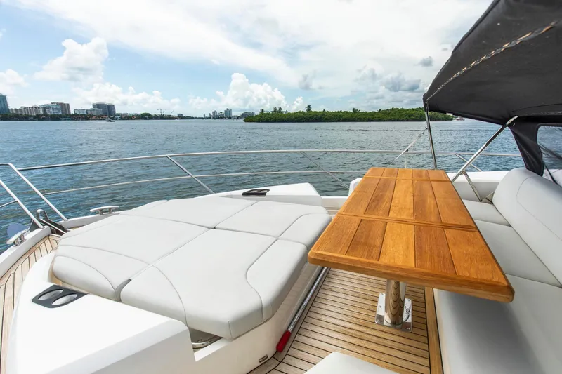 Slide: The Image of Luxurious Sunseeker Manhattan 68 yacht deck with seating and table, 2021 model. - 81