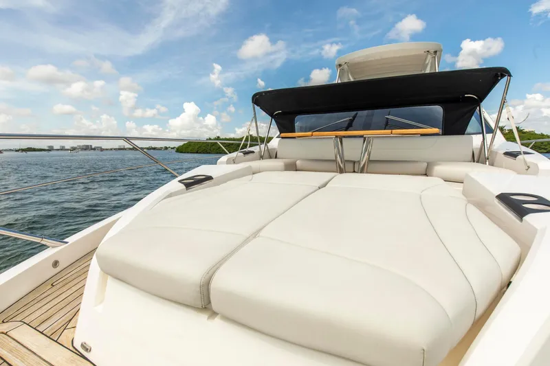 Slide: The Image of Luxurious Sunseeker Manhattan 68 yacht deck, 2021 model, with plush seating and ocean view. - 85