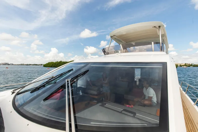 Slide: The Image of 2021 Sunseeker Manhattan 68 yacht on water, showcasing sleek design and spacious interior. - 90