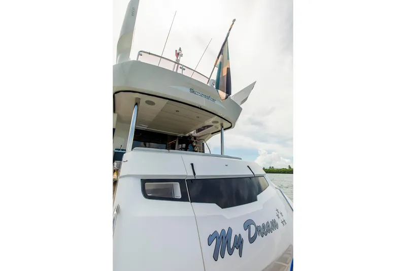 Slide: The Image of Sunseeker Manhattan 68 yacht, 2021 model, rear view with "My Dream" nameplate. - 98