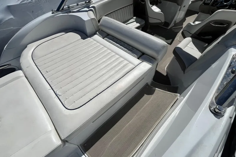 Slide: The Image of Interior of a 2006 Cobalt 272 boat featuring white leather seating and sleek design. - 10