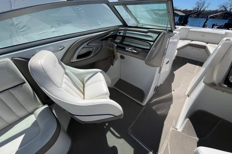 Slide: The Image of Interior of a 2006 Cobalt 272 boat with white seating and open cockpit. - 15
