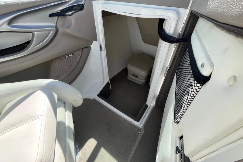 Slide: The Image of Interior cabin of a 2006 Cobalt 272 boat with a compact toilet. - 17