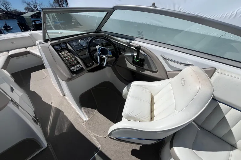 Slide: The Image of Interior of a 2006 Cobalt 272 boat showing steering wheel and seating. - 19