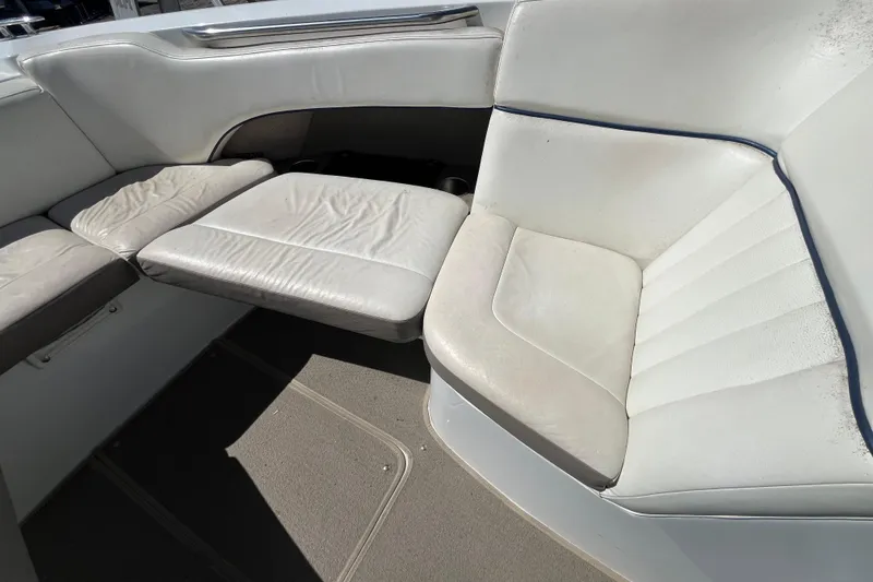 Slide: The Image of 2006 Cobalt 272 boat interior with white leather seating and carpeted floor. - 25