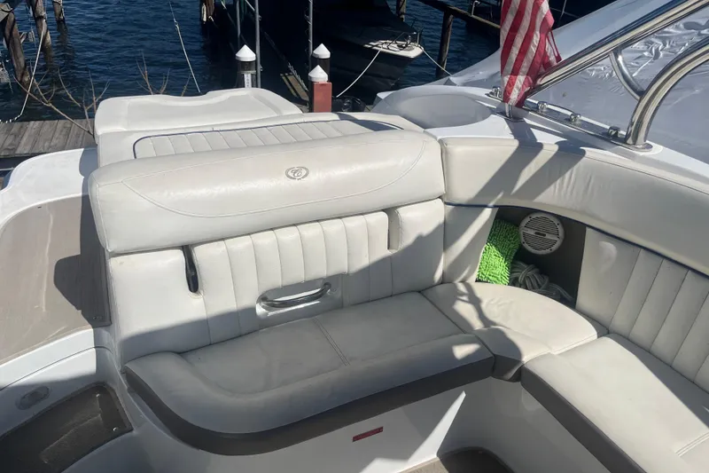 Slide: The Image of Interior of a 2006 Cobalt 272 boat with white leather seating. - 34