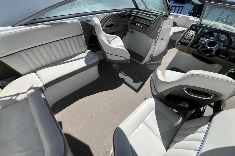 Slide: The Image of Interior of a 2006 Cobalt 272 boat with white seating and steering console. - 35