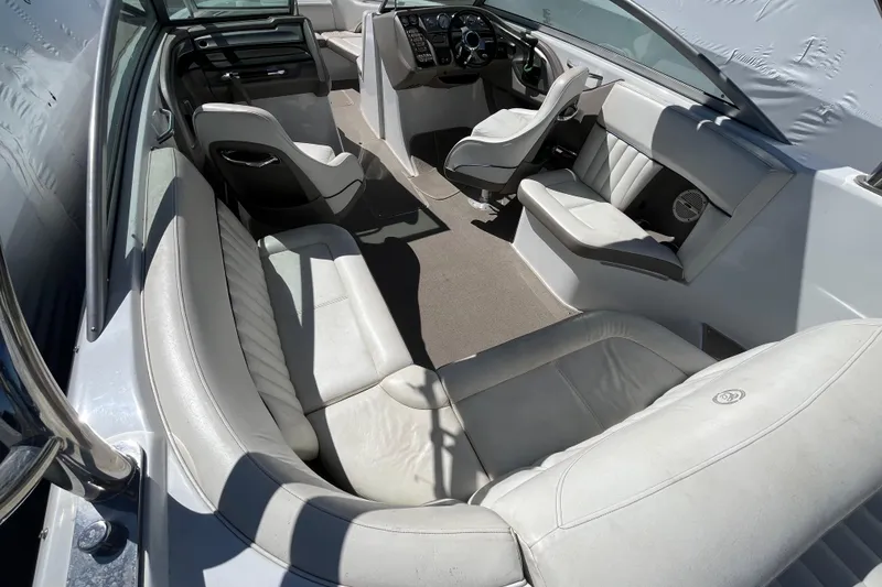 Slide: The Image of Interior of a 2006 Cobalt 272 boat with white leather seating. - 37