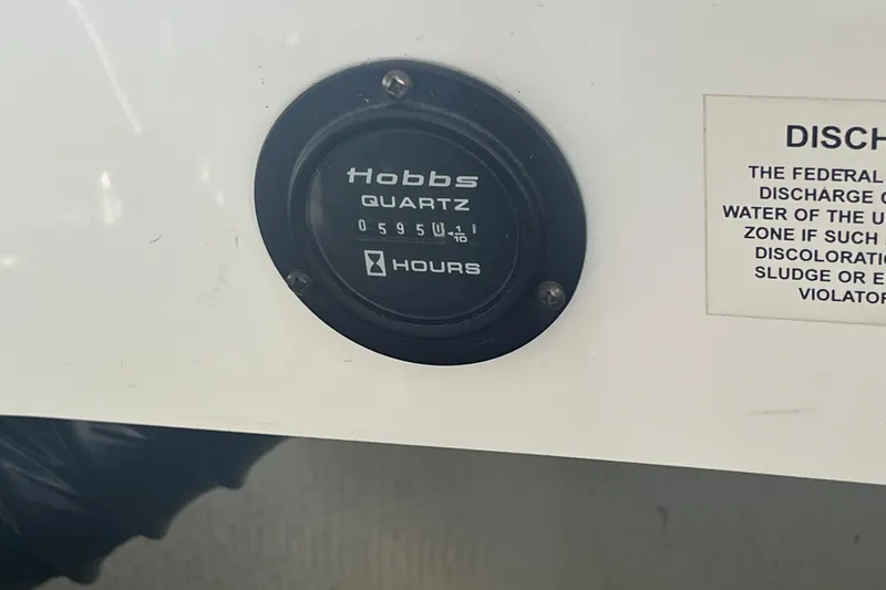 Slide: The Image of Hobbs hour meter on 2006 Cobalt 272 boat, displaying 595 hours. - 38