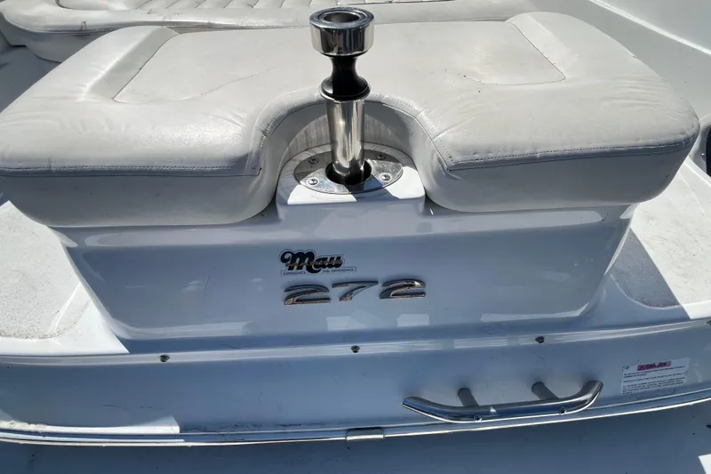 Slide: The Image of 2006 Cobalt 272 boat interior with white seating and chrome details. - 6