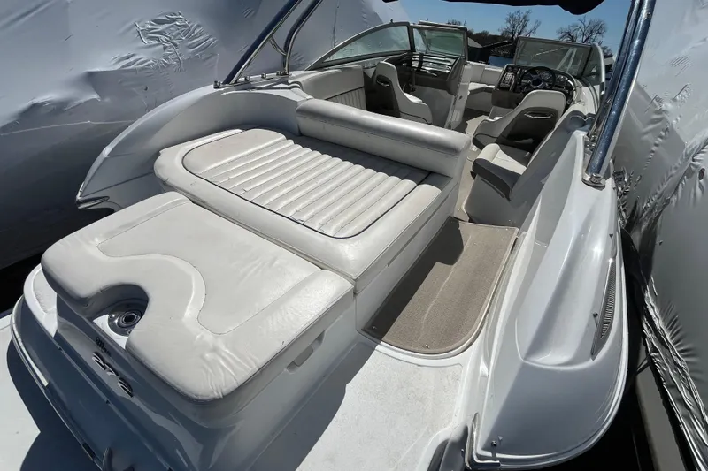 Slide: The Image of 2006 Cobalt 272 boat interior with white leather seating and modern dashboard. - 9