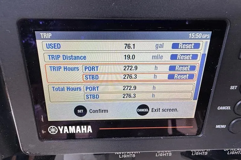 Slide: The Image of Yamaha trip display showing fuel usage and trip hours for Intrepid 289 Center Console, 2003. - 18