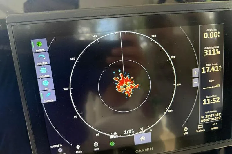 Slide: The Image of Garmin marine radar display on 2003 Intrepid 289 Center Console boat, showing GPS and water temperature. - 22