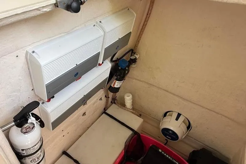 Slide: The Image of Interior of a 2003 Intrepid 289 Center Console boat with equipment and fire extinguisher. - 27