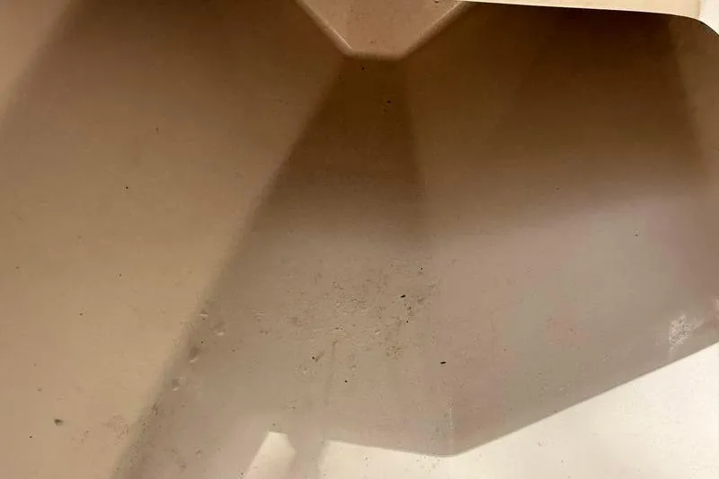 Slide: The Image of 2003 Intrepid 289 Center Console boat hull interior, showing wear and dirt. - 29