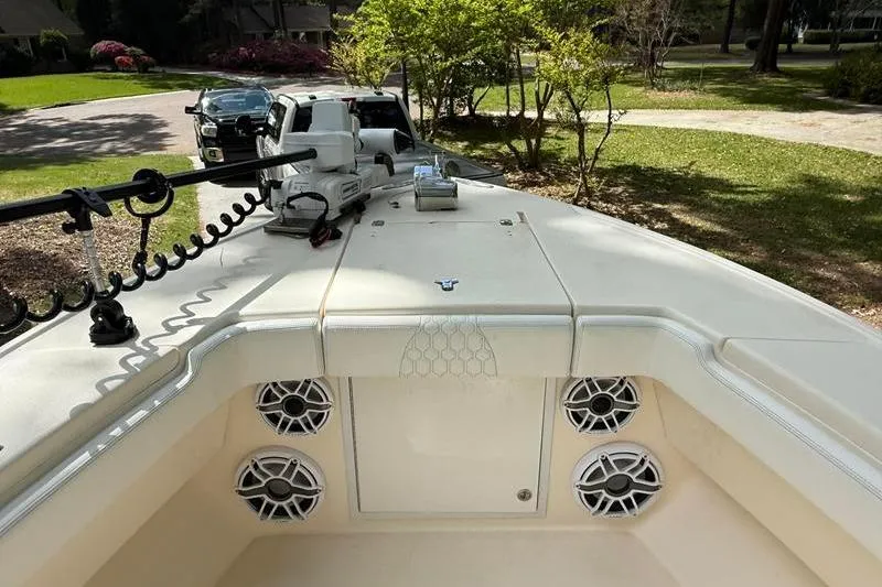 Slide: The Image of 2003 Intrepid 289 Center Console boat with speakers and trolling motor on deck. - 31