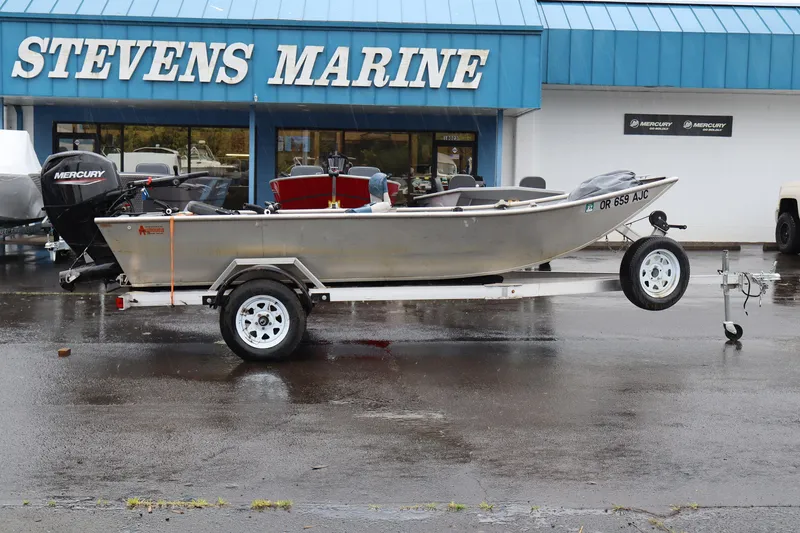 The Image of 1978 Alumaweld Flatbottom boat on trailer at Stevens Marine dealership. - 1