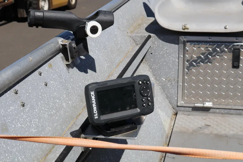 Slide: The Image of 1978 Alumaweld Flatbottom boat interior with Lowrance fish finder and rod holder. - 12