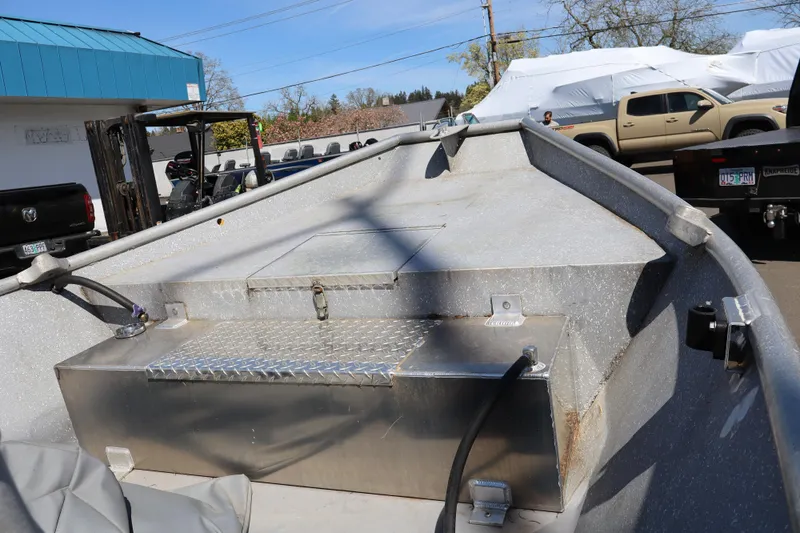 Slide: The Image of 1978 Alumaweld Flatbottom boat interior with metal storage compartment and visible wiring. - 19