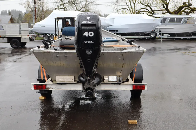 Slide: The Image of 1978 Alumaweld Flatbottom boat with Mercury 40 HP motor on trailer. - 5