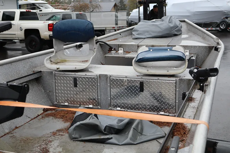 Slide: The Image of 1978 Alumaweld Flatbottom boat interior with seats and storage compartments. - 6